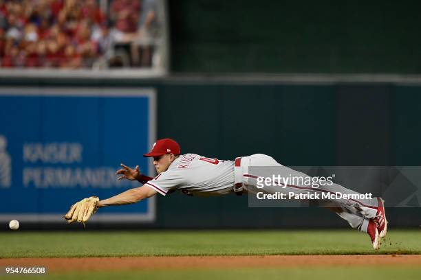 Scott Kingery of the Philadelphia Phillies dives for a single hit by Howie Kendrick of the Washington Nationals in the second inning at Nationals...