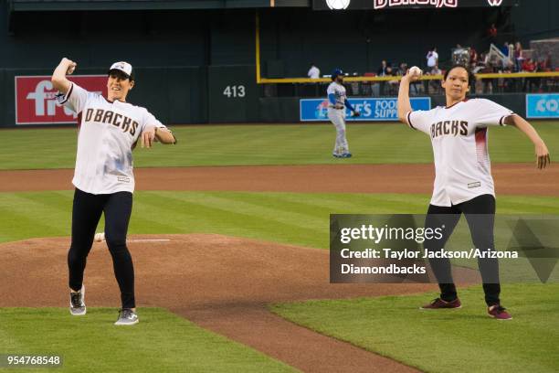 Women's Hockey player Julie Chu, and Canada Women's Ice Hockey player Caroline Oullette throw out the first pitch prior to a game vs. Los Angeles...