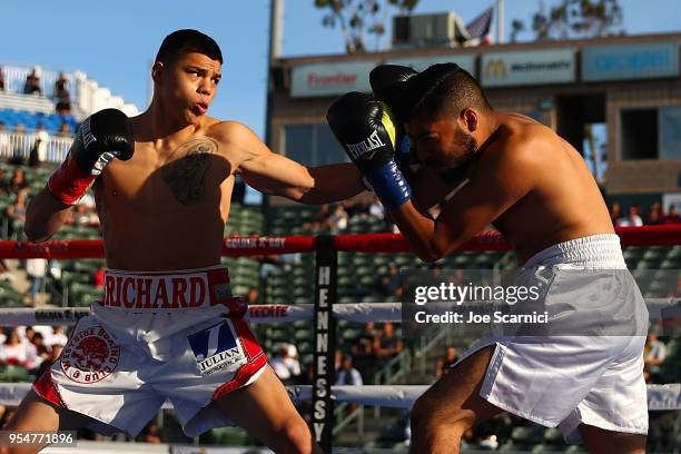 Richard Acevedo connects a left punch on Edward Aceves during the Super Welterweight fight at StubHub Center on May 4, 2018 in Carson, California.