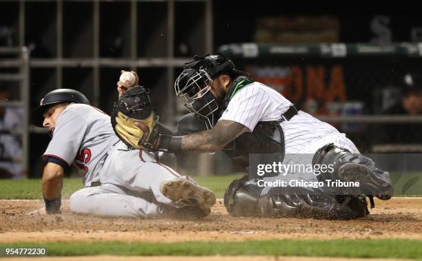 Chicago White Sox catcher Omar Narvaez, right, tags out the Minnesota Twins' Jason Castro at home plate in the fourth inning at Guaranteed Rate Field...