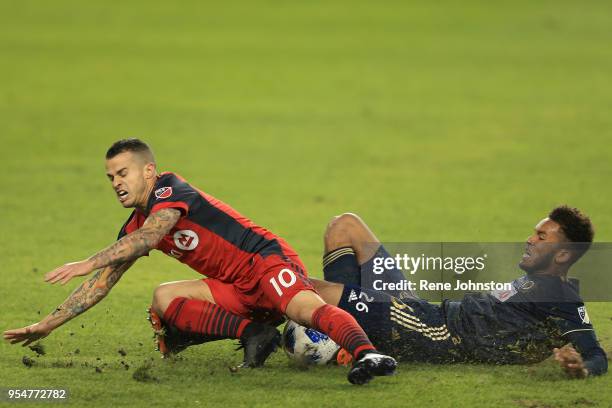 S star Sebastien Giovinco gets tackled by Auston Trusty of thePhiladelphia Union in the second half. Rene Johnston Toronto Star Photo