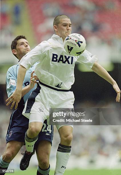 David Healy of Preston shields the ball from Bolton's Anthony Barness during the Nationwide Division One Playoff Final between Bolton Wanderers and...