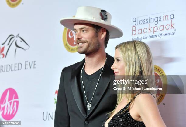 Actors Christopher Backus and Mira Sorvino attend the Unbridled Eve Gala during the 144th Kentucky Derby at Galt House Hotel & Suites on May 4, 2018...