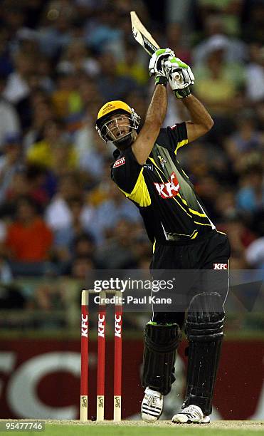 Theo Doropoulos of the Warriors hits out during the Twenty20 Big Bash match between the West Australian Warriors and the South Australian Redbacks at...