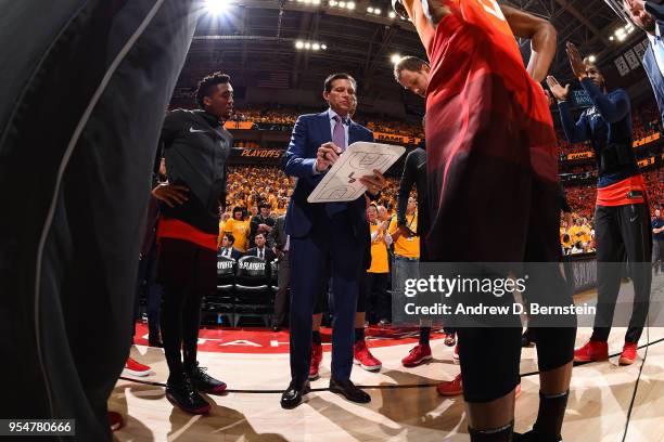 Head Coach Quin Snyder of the Utah Jazz writes a play during a huddle before the game against the Houston Rockets during Game Three of the Western...