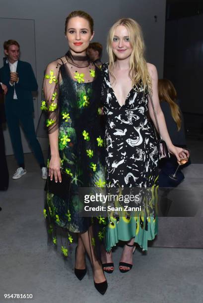 Actor Dianna Agron and Actor Dakota Fanning attend the Prada Resort 2019 fashion show on May 4, 2018 in New York City.