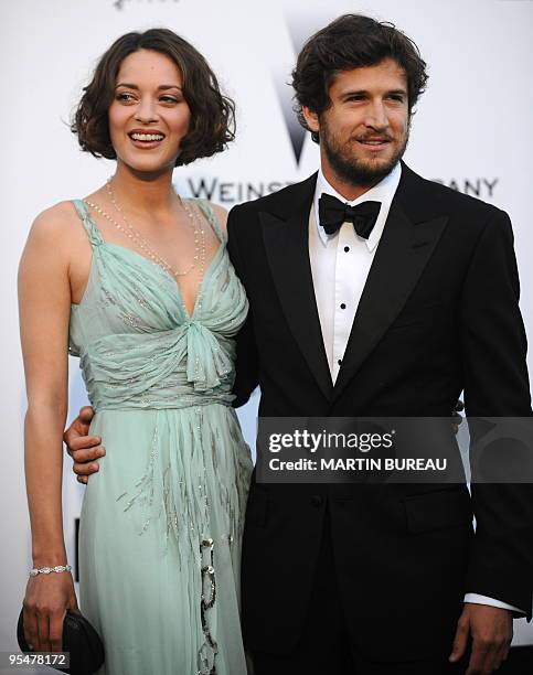 French actor and director Guillaume Canet and actress Marion Cotillard arrive to attend the Amfar auction on May 21, 2009 in Antibes, southern...