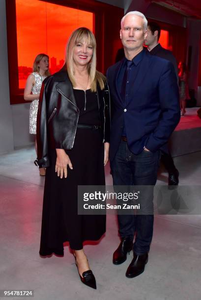 Maria Bell and MoMA PS1 Director Klaus Biesenbach attend the Prada Resort 2019 fashion show on May 4, 2018 in New York City.