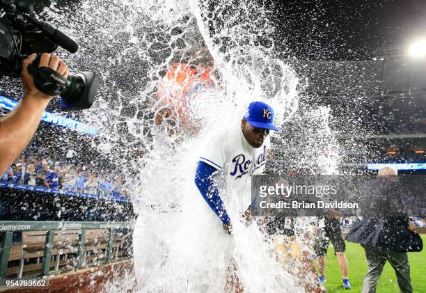 Jorge Soler of the Kansas City Royals gets water dumped on him by teammate Salvador Perez after defeating the Detroit Tigers at Kauffman Stadium on...