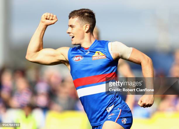 Josh Dunkley of the Bulldogs celebrates after kicking a goal during the round seven AFL match between the Western Bulldogs and the Gold Coast Suns at...