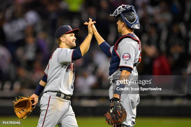 Minnesota Twins' Brian Dozier and Minnesota Twins catcher Jason Castro celebrate the win against the Chicago White Sox on May 4, 2018 at Guaranteed...