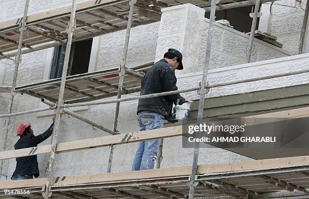 Thai laborers work in the construction of new house units in the Maaleh Hazeitim settlement, in the Ras al-Amud area of mostly arab east Jerusalem,...