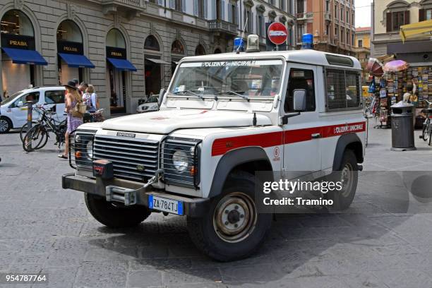 land rover defender police suv on the street - land rover white stock pictures, royalty-free photos & images