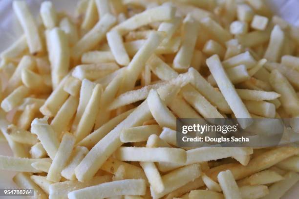 full frame of fast food frozen french fries - frozen french fries stock pictures, royalty-free photos & images