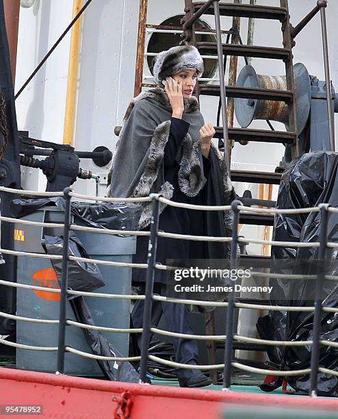 Angelina Jolie takes a break from filming on location for "Salt" on a boat in the Hudson River on December 28, 2009 in New York City.