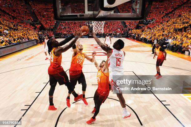 Clint Capela of the Houston Rockets and Jae Crowder of the Utah Jazz reach for the ball during the game between the two teams during Game Three of...