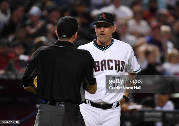 Manager Torey Lovullo of the Arizona Diamondbacks talks with home plate umpire Dan Iassogna during the ninth inning against the Houston Astros at...