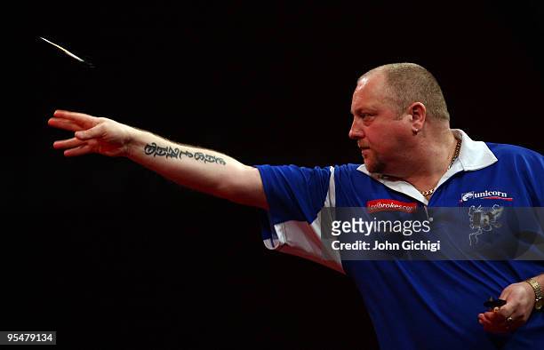 Andy Hamilton of England in action during his match against Steve Beaton of England at the 2010 Ladbrokes.com World Darts Championship, at Alexandra...