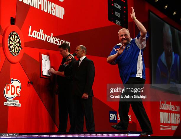 Andy Hamilton of England celebrates during his match against Steve Beaton of England during the 2010 Ladbrokes.com World Darts Championship, at...