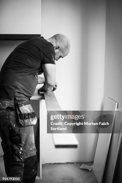 marking a baseboard for cutting - baseboard stock pictures, royalty-free photos & images