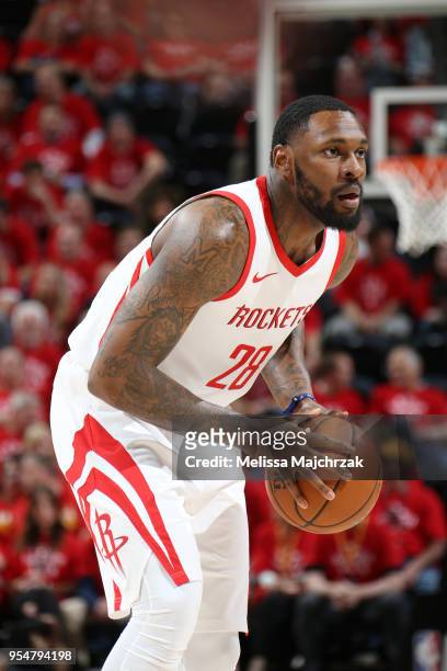 Tarik Black of the Houston Rockets handles the ball during the game against the Utah Jazz during Game Three of the Western Conference Semifinals of...