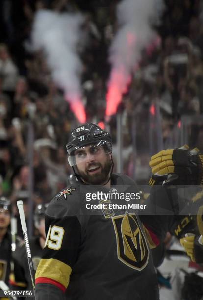 Alex Tuch of the Vegas Golden Knights celebrates with teammates on the bench after scoring a goal against the San Jose Sharks in the third period of...