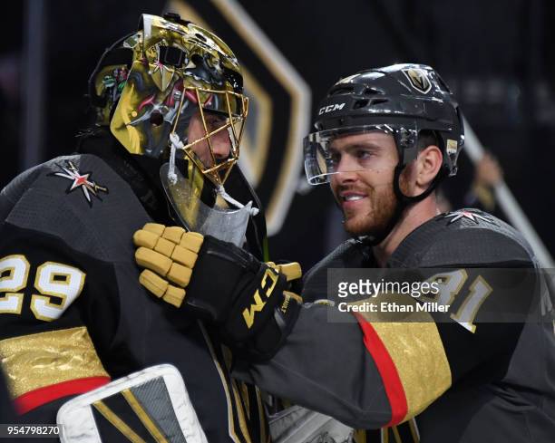 Marc-Andre Fleury and Jonathan Marchessault of the Vegas Golden Knights celebrate after beating the San Jose Sharks 5-3 in Game Five of the Western...