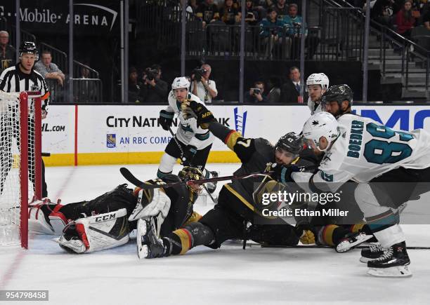 Mikkel Boedker of the San Jose Sharks scores a goal against Luca Sbisa and Marc-Andre Fleury of the Vegas Golden Knights in the third period of Game...