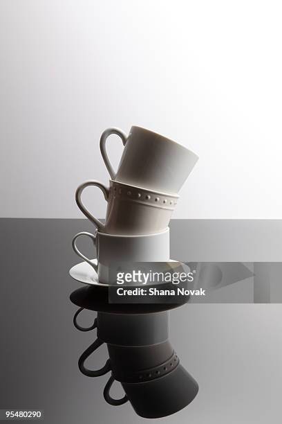 stacked teacup and coffee mugs - stackable foto e immagini stock