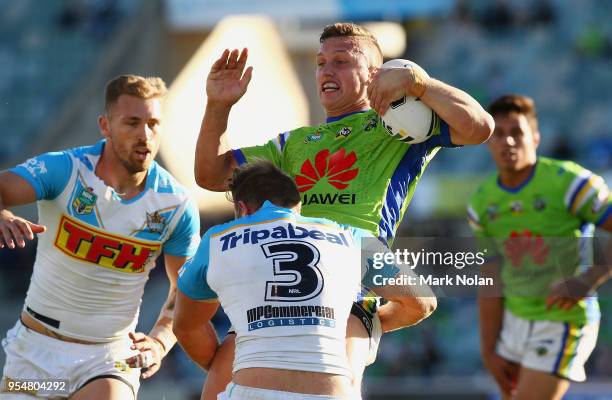 Jack Wighton of the Raiders is tackled during the round nine NRL match between the Canberra Raiders and the Gold Coast Titans at GIO Stadium on May...