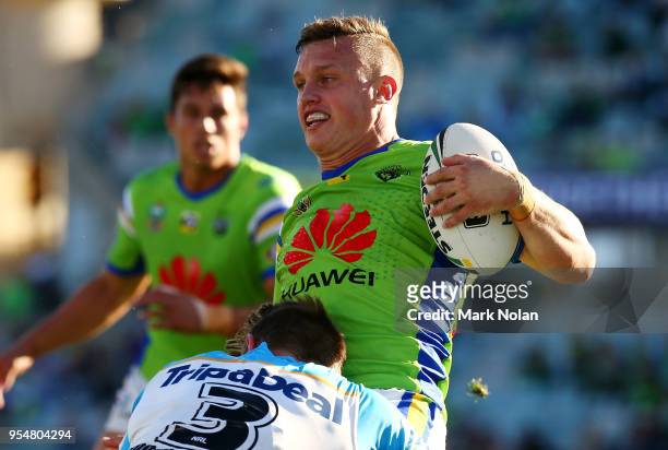 Jack Wighton of the Raiders is tackled during the round nine NRL match between the Canberra Raiders and the Gold Coast Titans at GIO Stadium on May...
