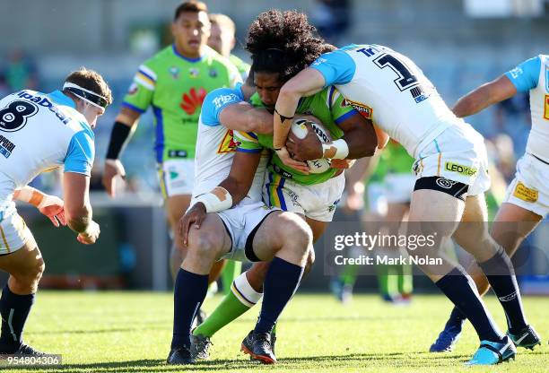 Iosia Soliola of the Raiders is tackled during the round nine NRL match between the Canberra Raiders and the Gold Coast Titans at GIO Stadium on May...