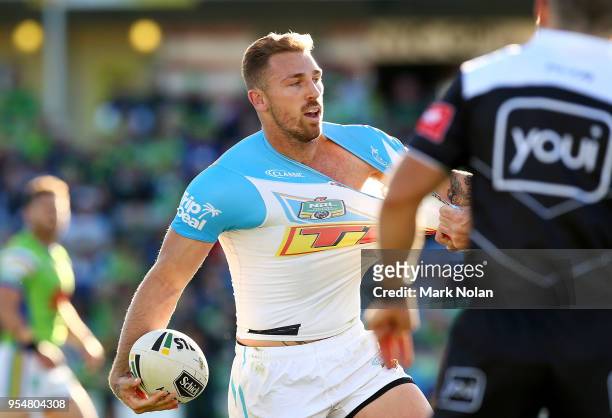 Bryce Cartwright of the Titans looks to offload during the round nine NRL match between the Canberra Raiders and the Gold Coast Titans at GIO Stadium...