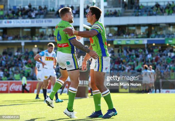 Joseph Tapine of the Raiders is congratulated after scoing during the round nine NRL match between the Canberra Raiders and the Gold Coast Titans at...