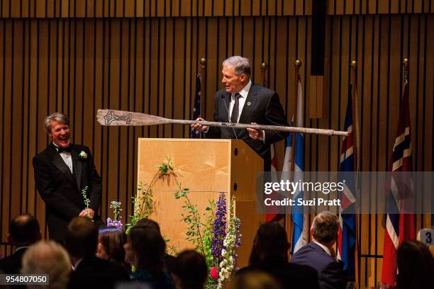 Nordic Museum Executive Director Eric Nelson accepts a gift from Washington Governor Jay Inslee at the Nordic Museum on May 4, 2018 in Seattle,...