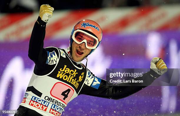 Andreas Kofler of Austria celebrates after winning the FIS Ski Jumping World Cup event at the 58th Four Hills ski jumping tournament at the Erding...