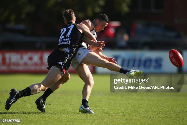 Thomas Wilson of the Blues is tackled by Mitchell Mccarthy of Frankston during the round five VFL match between Frankston and the Northern Blues at...