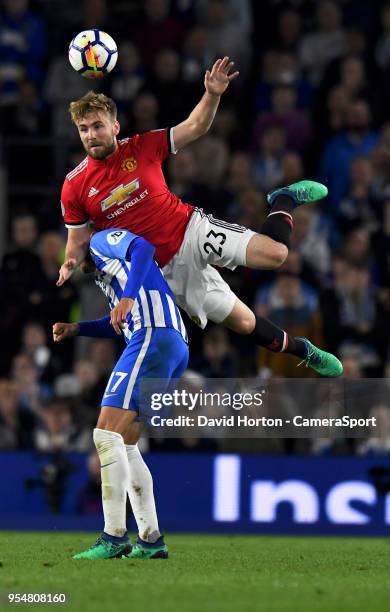 Manchester United's Luke Shaw battles with Brighton & Hove Albion's Glenn Murray during the Premier League match between Brighton and Hove Albion and...