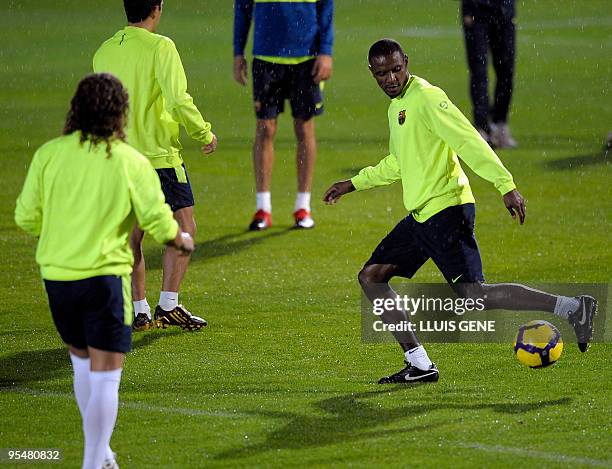 Barcelona's French defender Eric Abidal plays with the ball during a training session at Ciutat Esportiva Joan Gamper near Barcelona on December 29,...