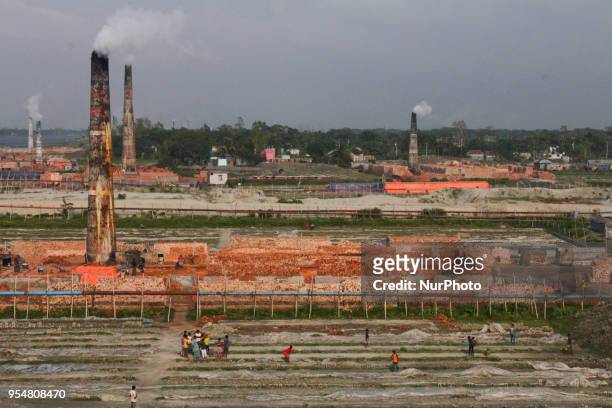 Brick-field workers playing cricket after finish their days work at their brick-field, in Dhaka, Bangladesh, on May 4, 2018.