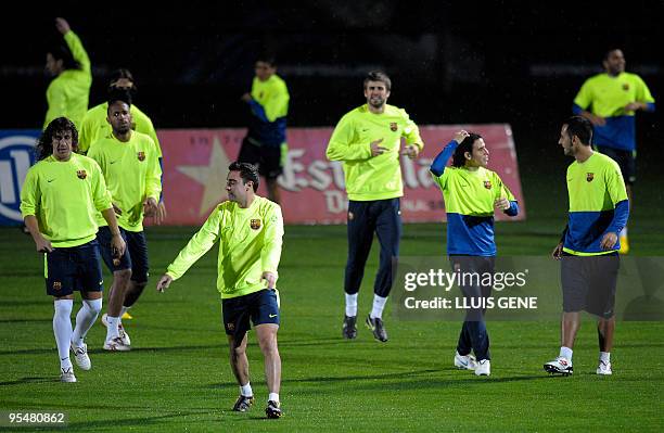 Barcelona's playeRs attend a training session at Ciutat Esportiva Joan Gamper near Barcelona on December 29, 2009. AFP PHOTO/LLUIS GENE
