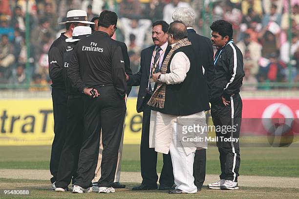 Ground and pitch committee chairman Chetan Chauhan with the on-field umpires, match referee and DDCA curator Vijay Bahadur Mishra discuss about the...