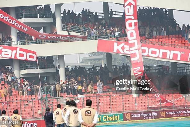 Angry Indian cricket fans show their frustration by destroying property after the cancellation of the fifth and final One Day International cricket...