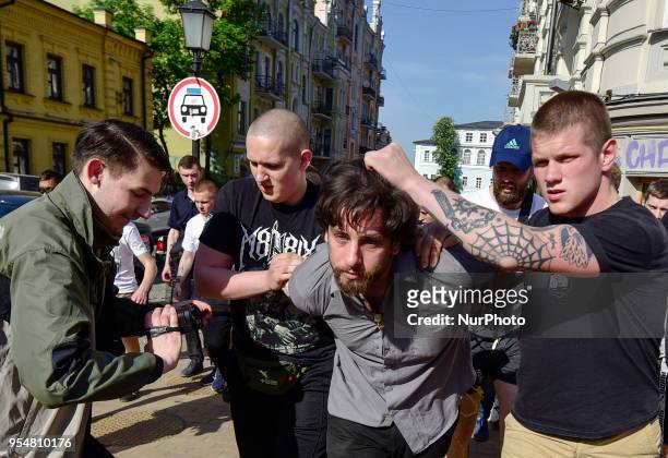Activists of a Ukrainian far-right movements hold a 33-year-old Brazilian Rafael Lusvarghi, a former volunteer fighter and poster boy for...