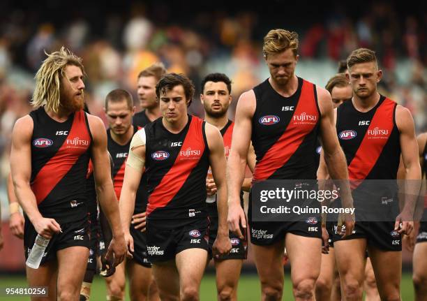 Dyson Heppell and his Bombers team mates look dejected after losing the round seven AFL match between the Essendon Bombers and the Hawthorn Hawks at...