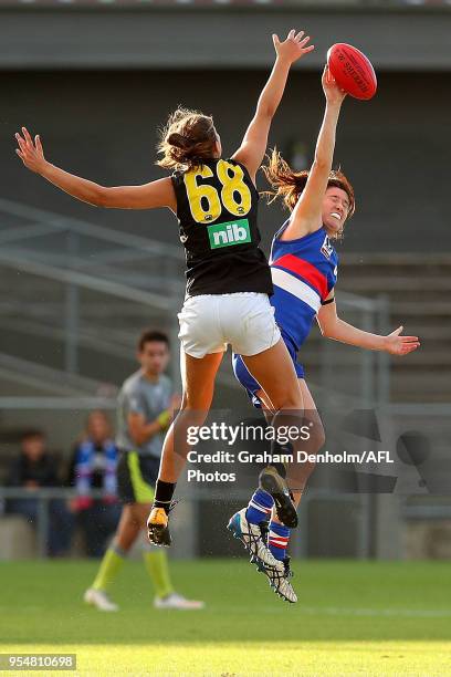 Amanda Tessari of the Western Bulldogs and Alice Edmonds of Richmond compete in the air during the round one AFLW match between the Western Bulldogs...