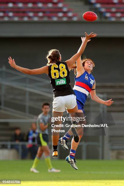 Amanda Tessari of the Western Bulldogs and Alice Edmonds of Richmond compete in the air during the round one AFLW match between the Western Bulldogs...