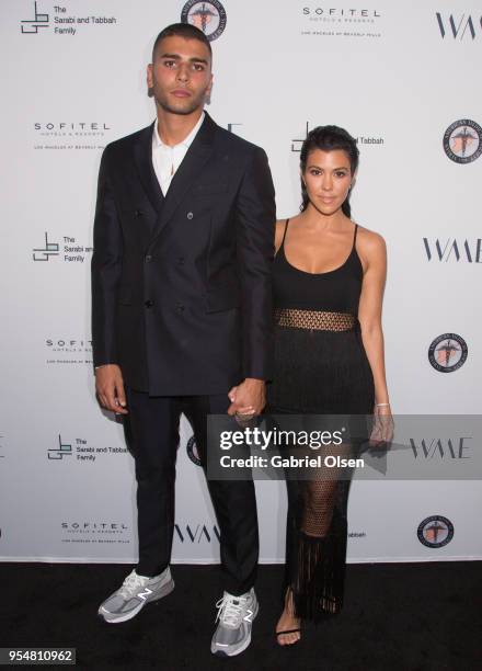 Younes Bendjima and Kourtney Kardashian arrive for The Syrian American Medical Society hosts the Voices in Displacement Gala at Riviera 31 at Sofitel...