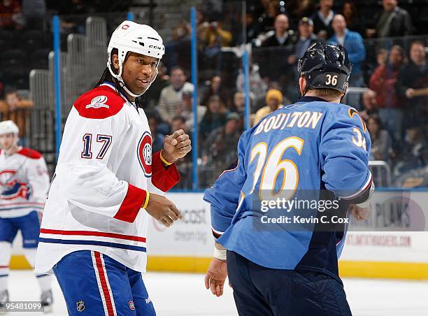 Georges Laraque of the Montreal Canadiens fights with Eric Boulton of the Atlanta Thrashers at Philips Arena on December 12, 2009 in Atlanta, Georgia.