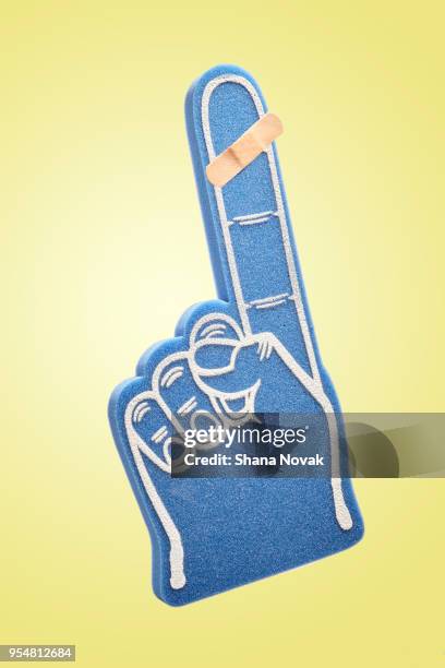 bandaged foam finger - foam hand stock pictures, royalty-free photos & images